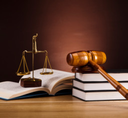 Consumer Protection claims in Louisiana often involve legal instruments like these legal books, the scales of justice and the judge's gavel.