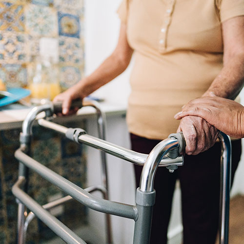 caregiver helping a senior woman